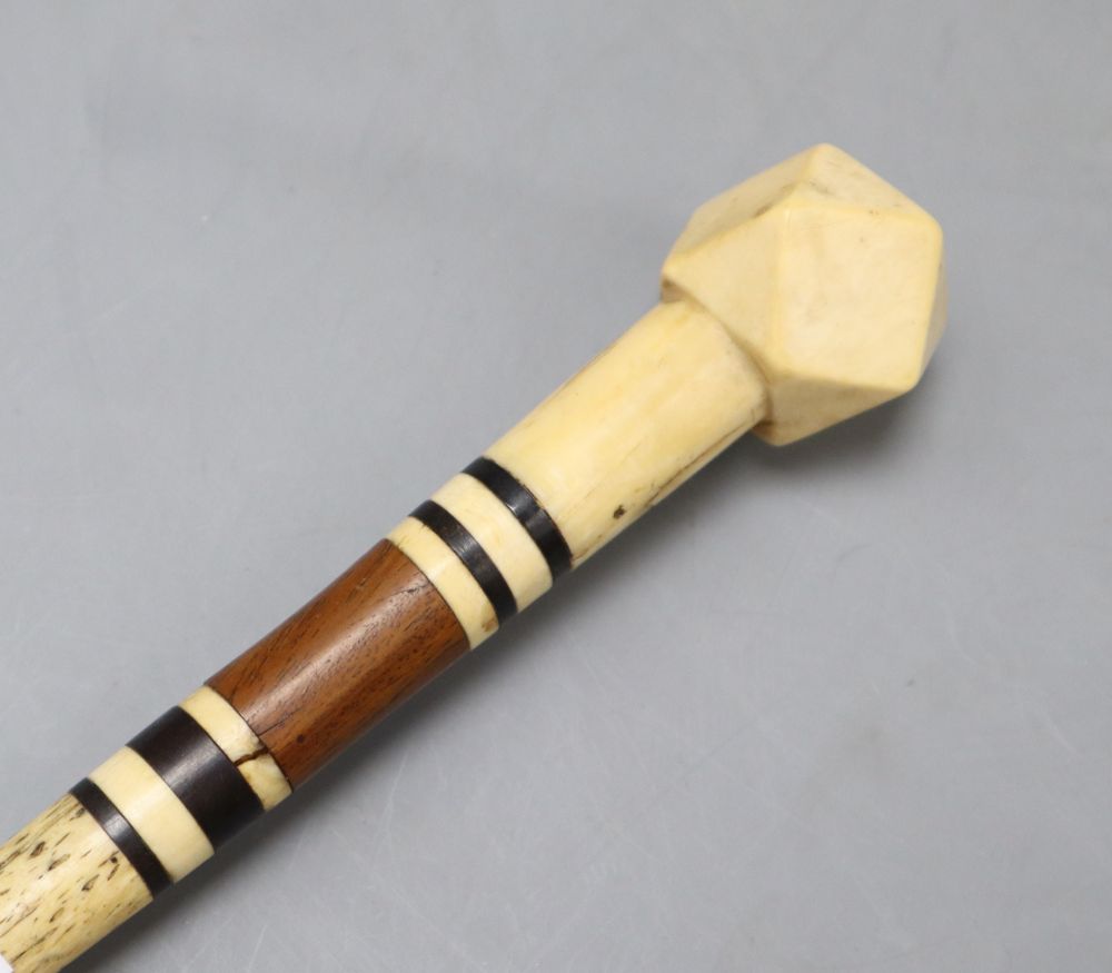 A 19th century whalebone and marine ivory walking stick, length 89cm